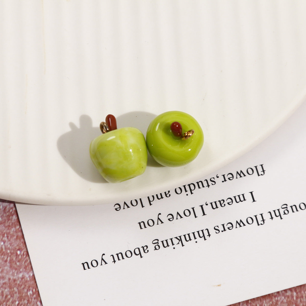 Lime green whole apple resin pendants, two glossy apples with metal loops and stems