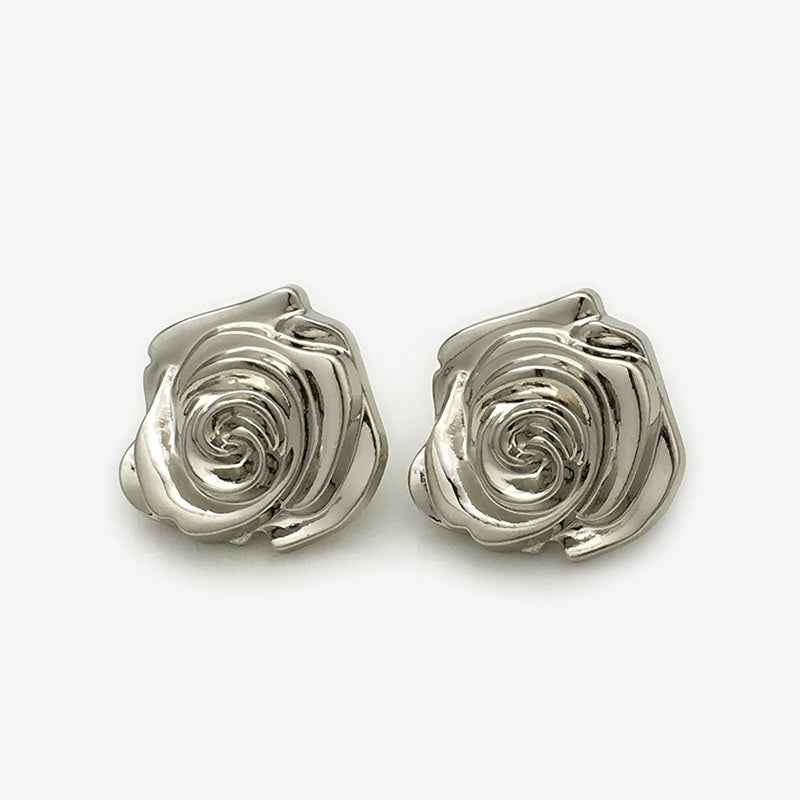 Silver metal 3D rose flower buttons, raised swirl petals, pair close-up