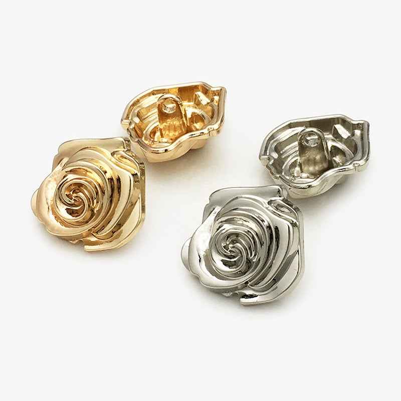 Gold and silver rose flower metal buttons, shank backs visible