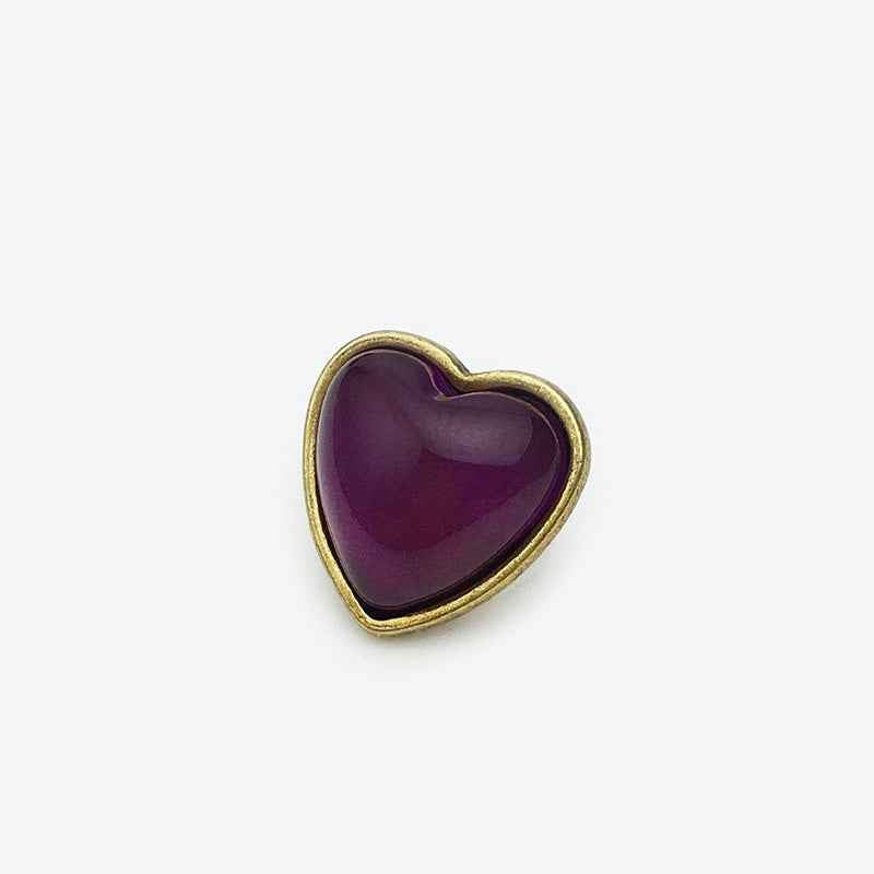 15mm heart buttons, purple center with gold-tone border (front view)