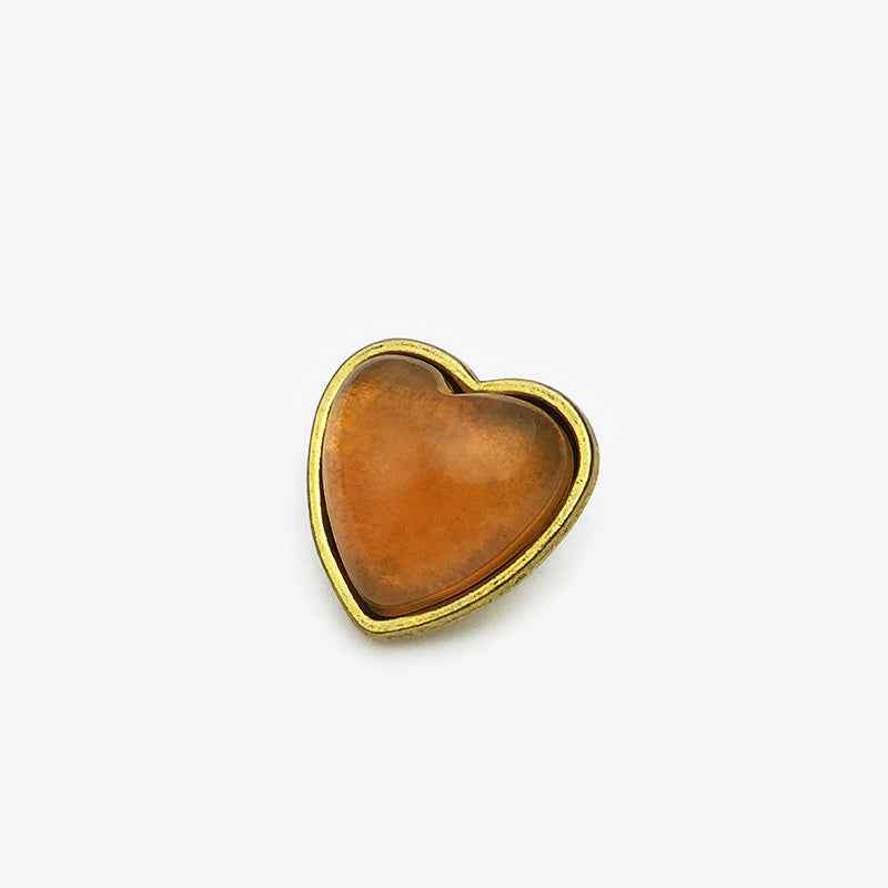 15mm heart buttons, yellow/amber center with gold-tone border (front view)