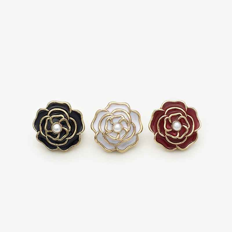Set of 3 rose metal shank buttons: black, white, and red with pearl centers