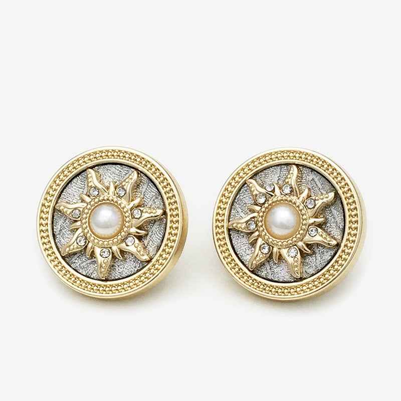 Pair of round gold sun buttons with pearl center and rhinestone details