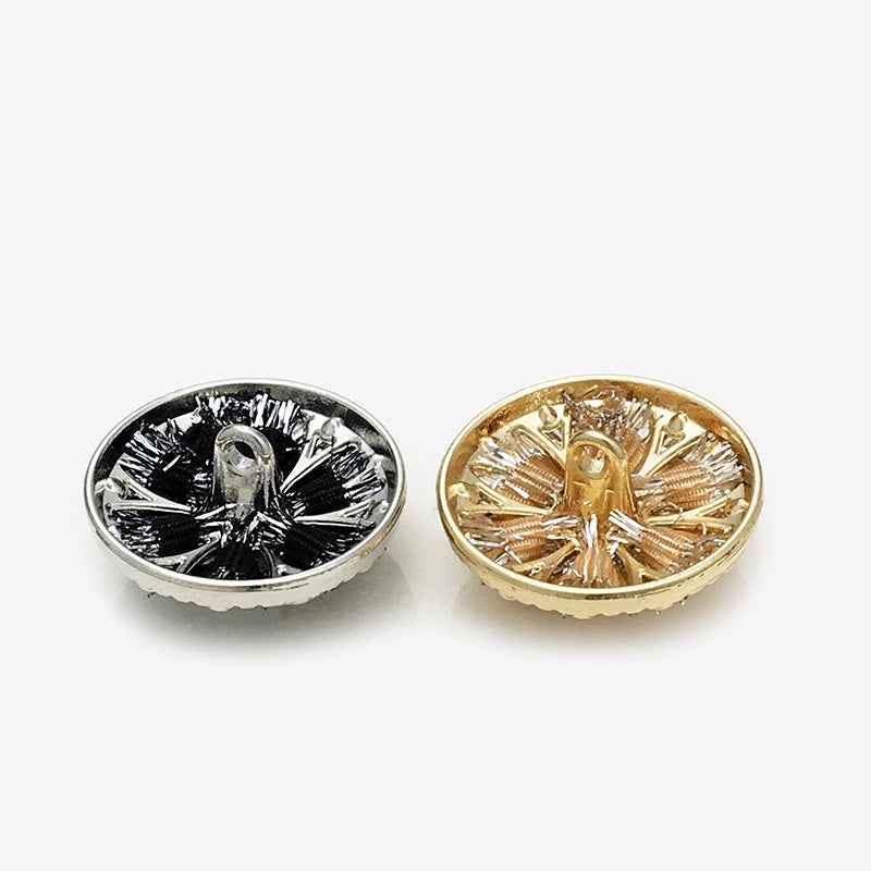 Two floral shank buttons: black with pearl and rhinestones, plus champagne gold tone