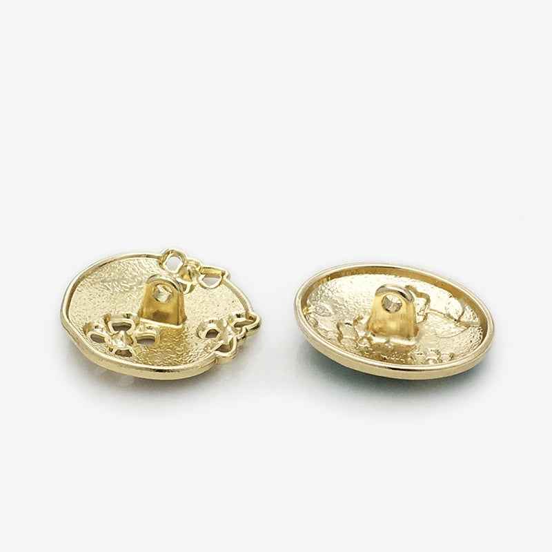 Back of oval floral enamel metal button, gold-tone with metal shank and posts