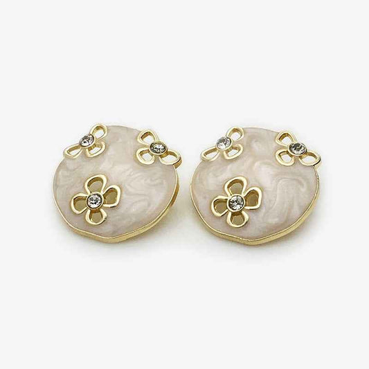 Oval floral enamel metal button, white with gold edges and rhinestone flower details