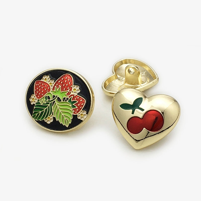 One strawberry (22mm) front and one cherry (20mm) front, red fruit, gold accents